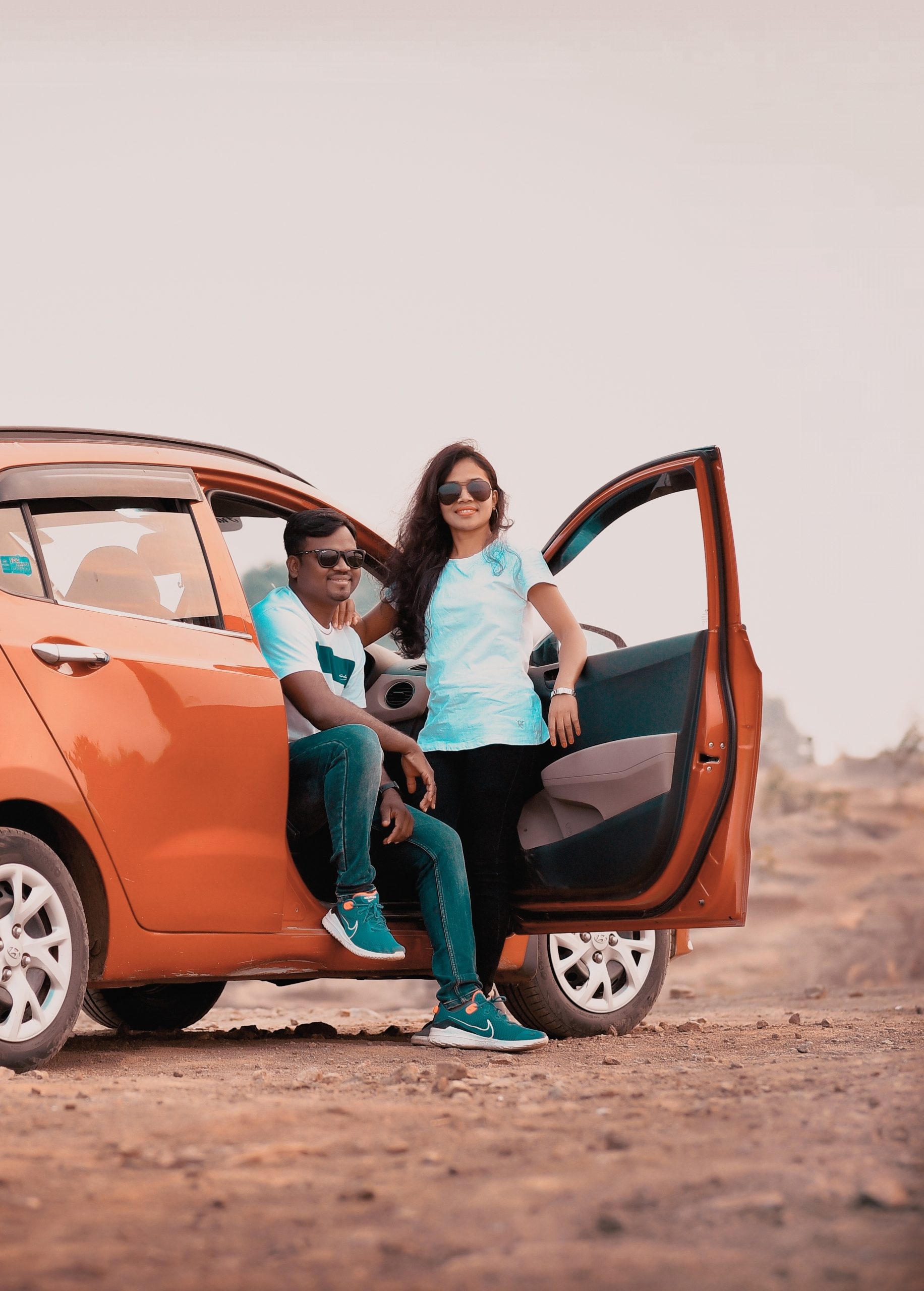 A couple with a car