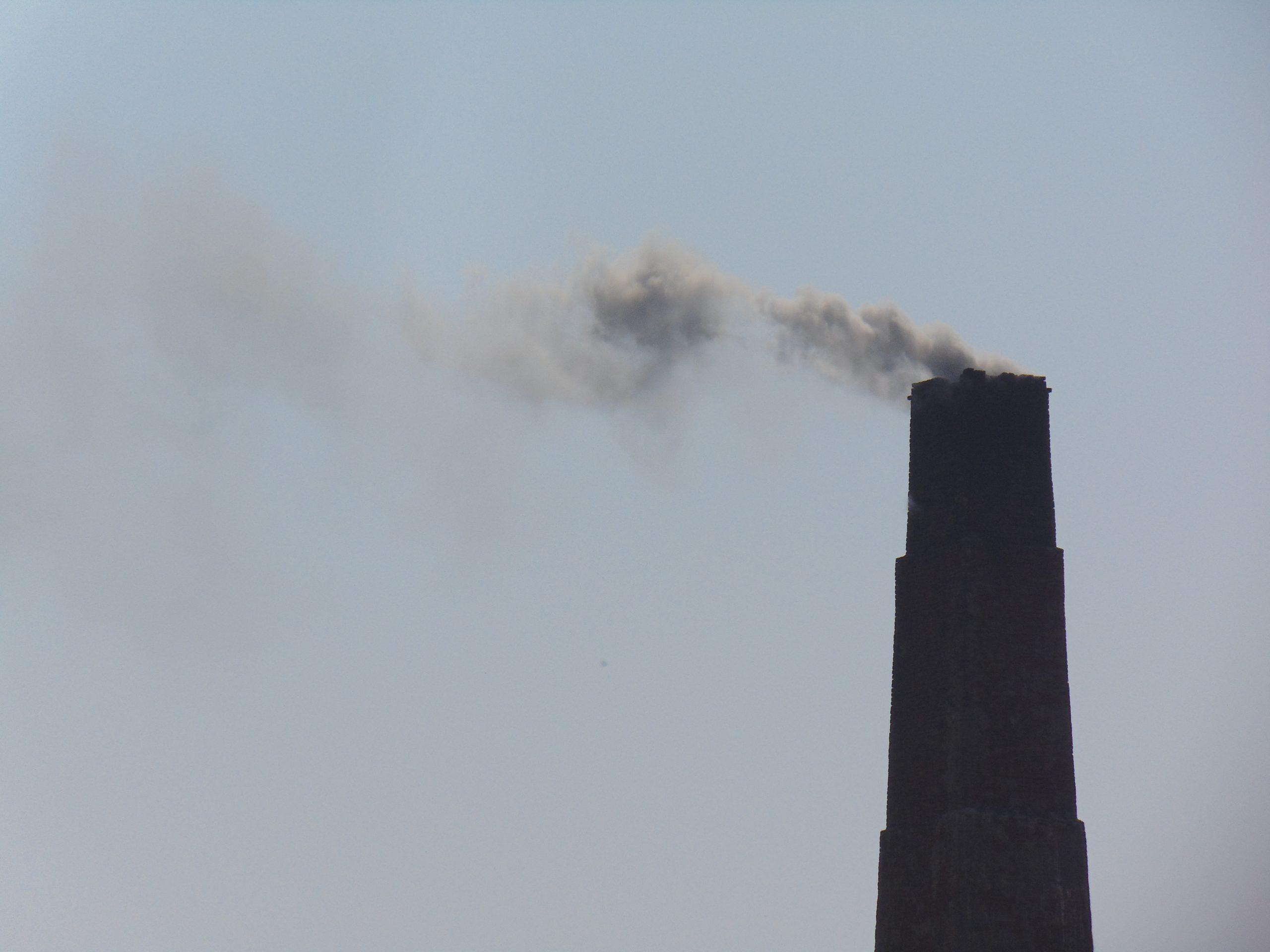 A factory chimney emitting smoke