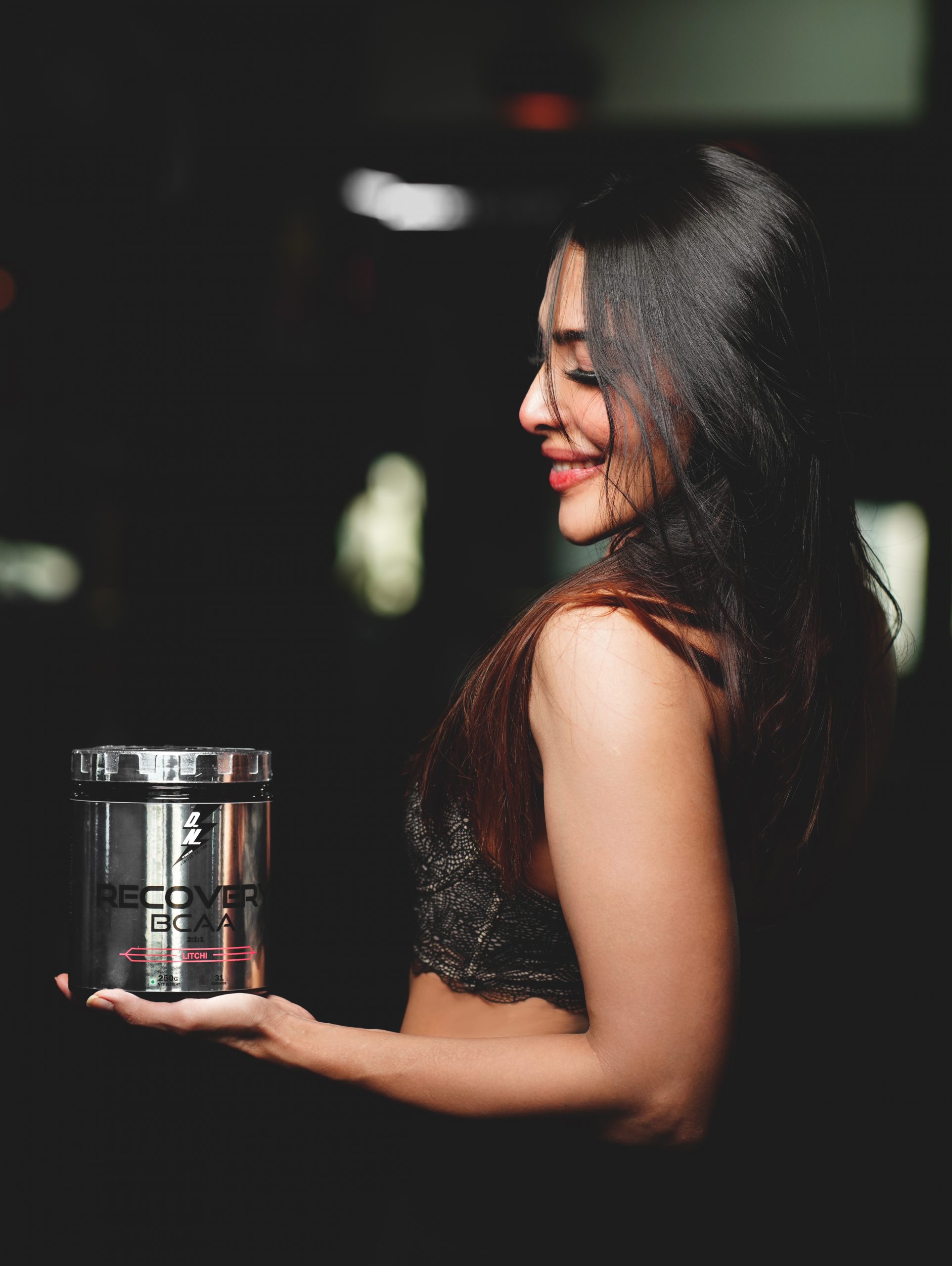 A girl with a supplement box
