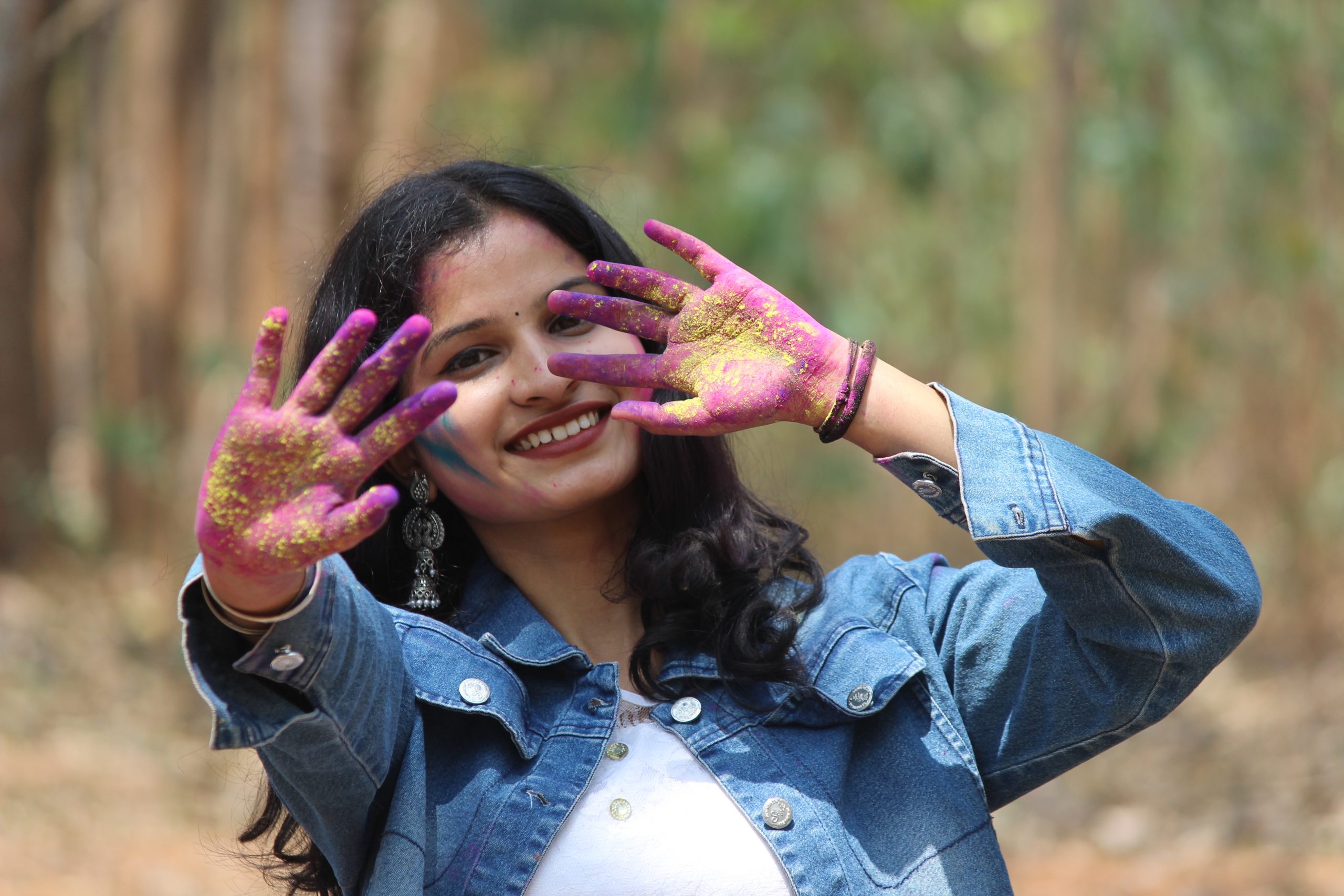 A happy girl celebrating Holi festival