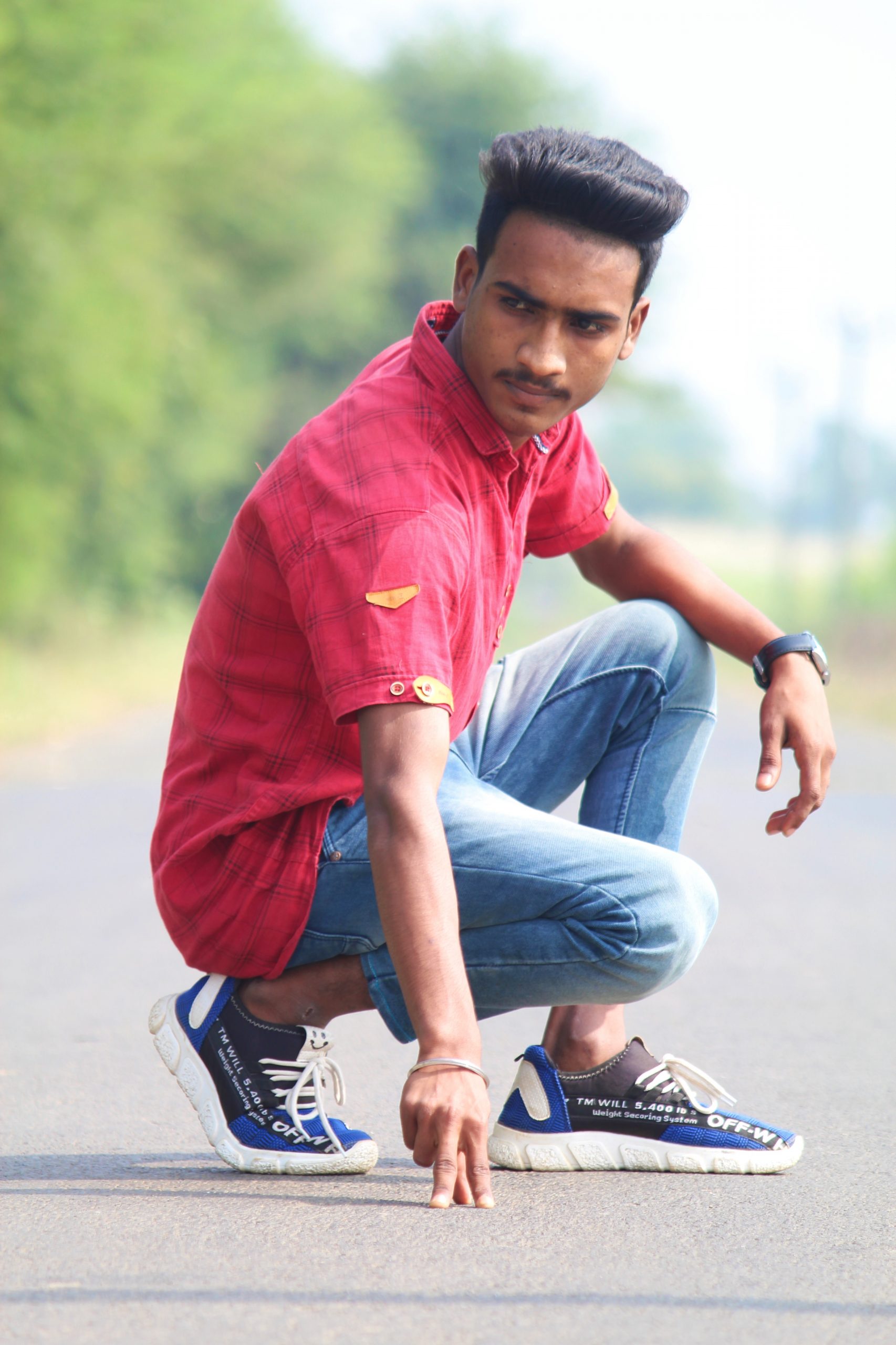 Boy posing on road