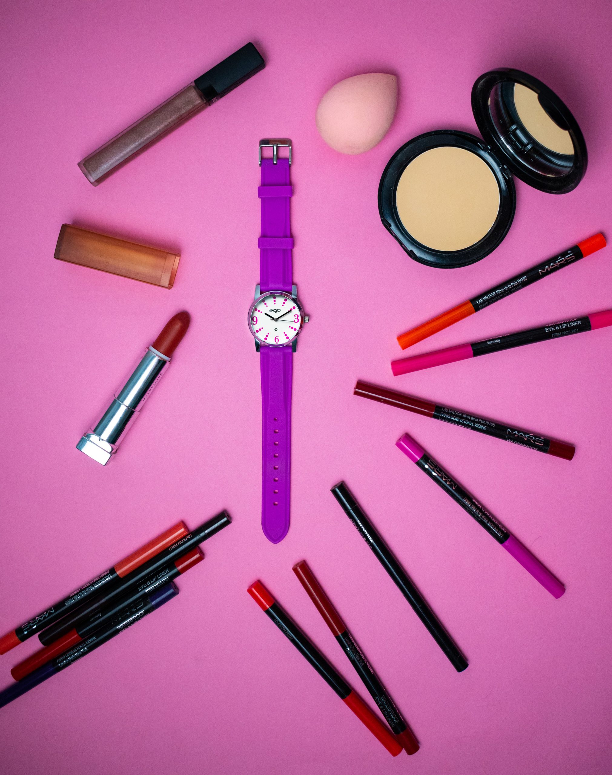 A wrist watch and cosmetic items
