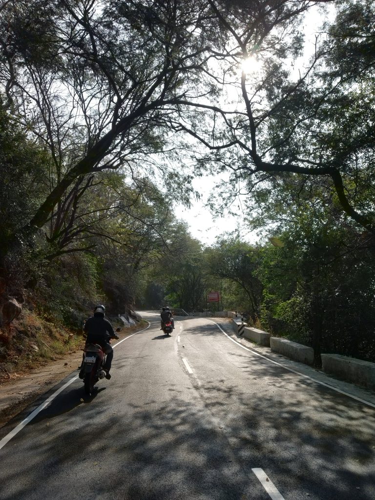 Bikes passing through a hill station road - PixaHive