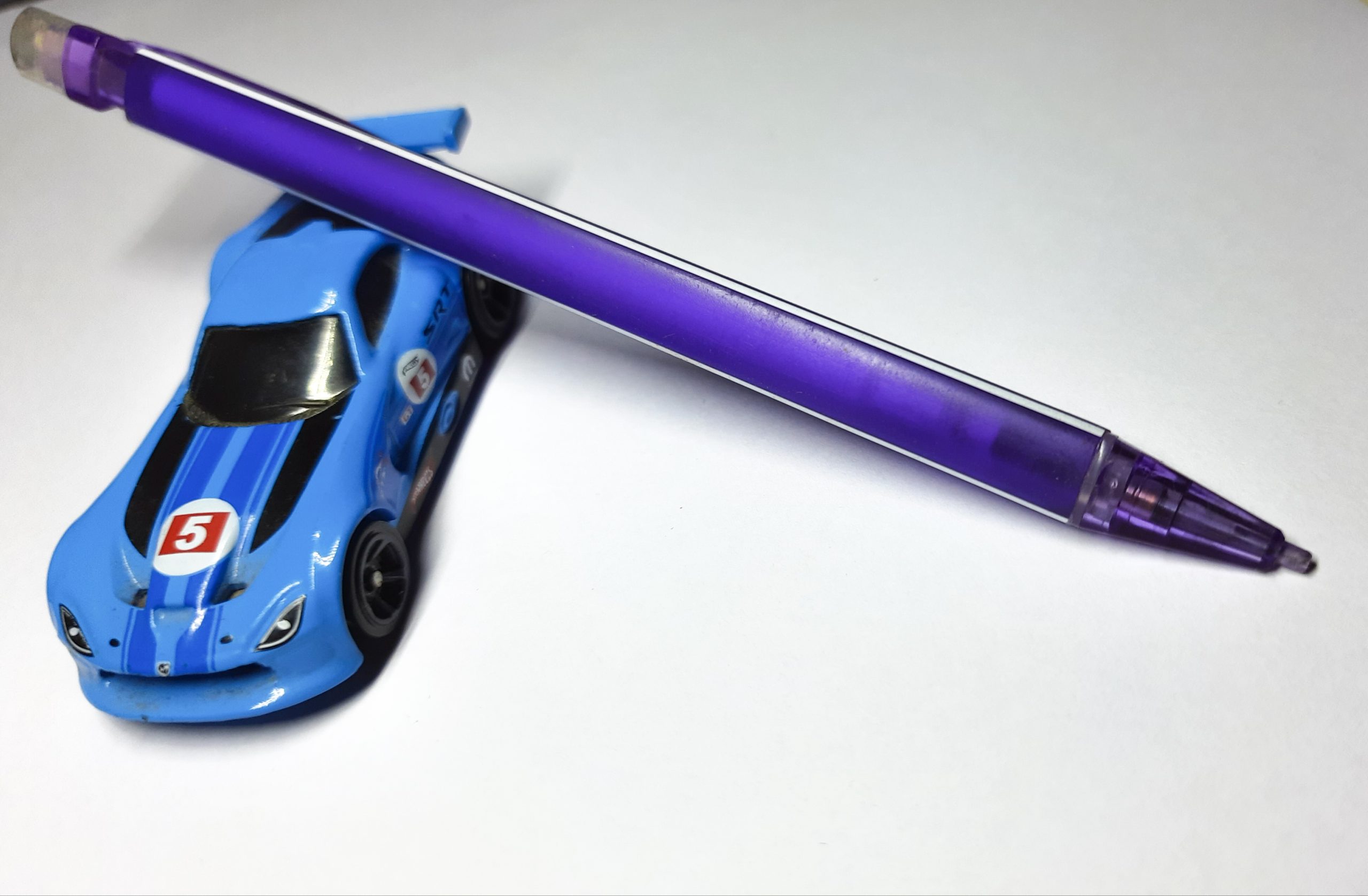 A toy car and pen
