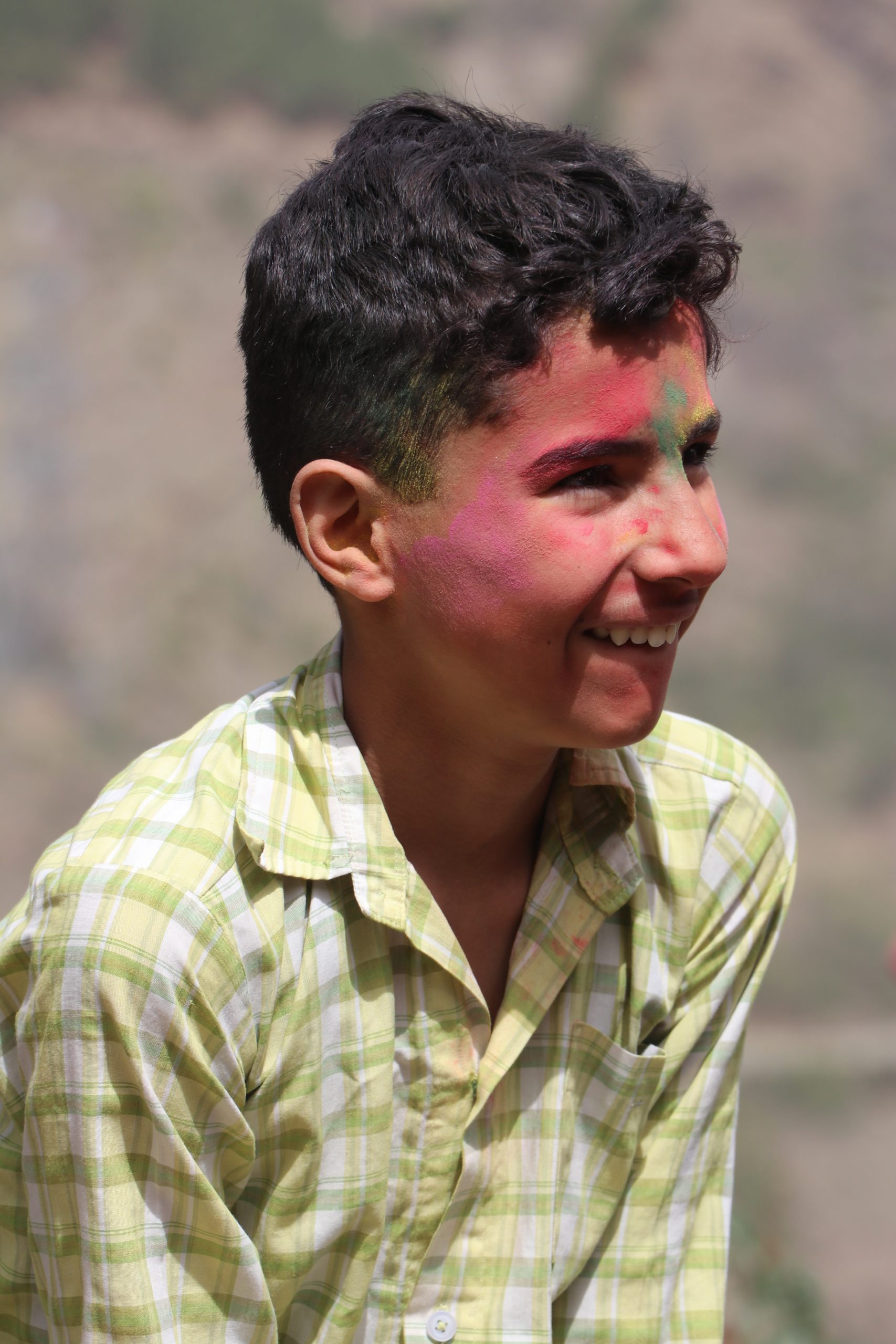 Boy with Holi colors on him