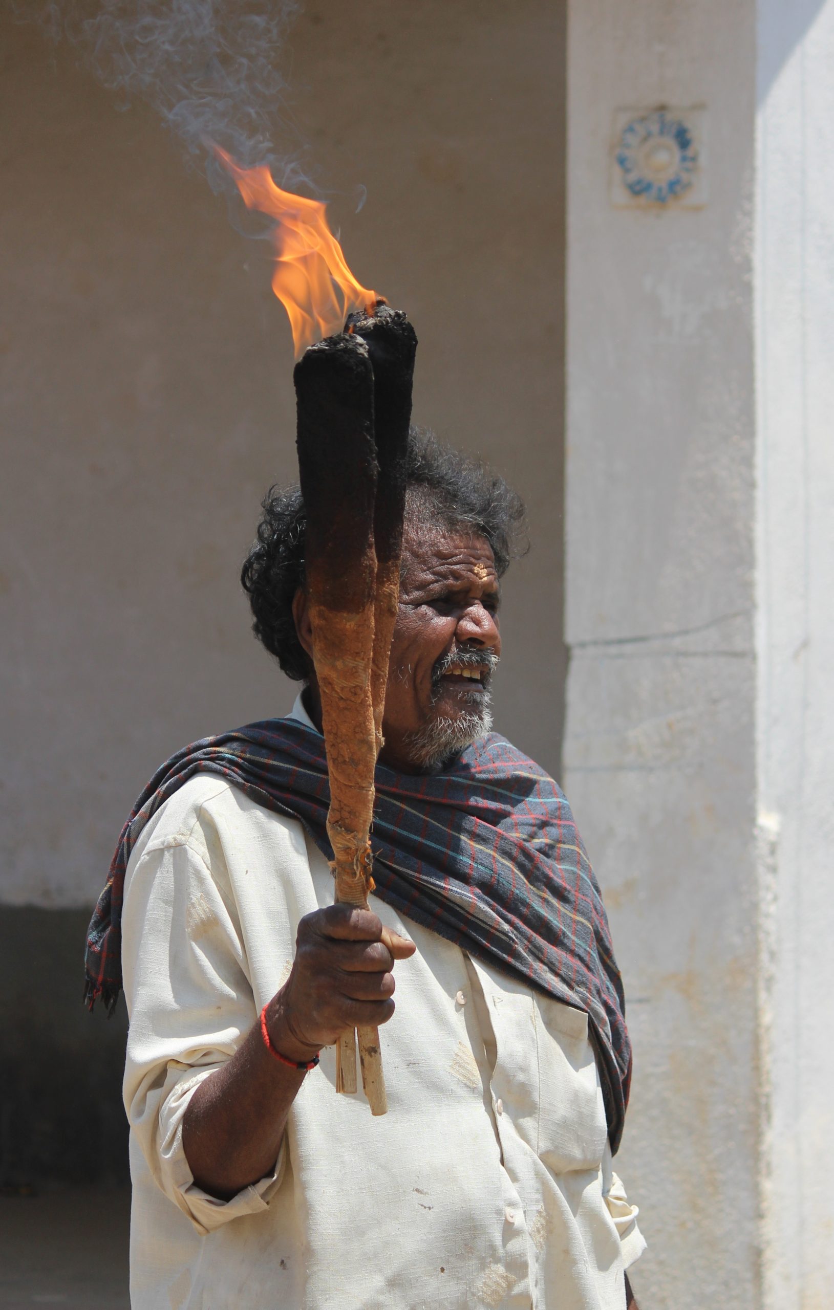 A man holding a fire torch