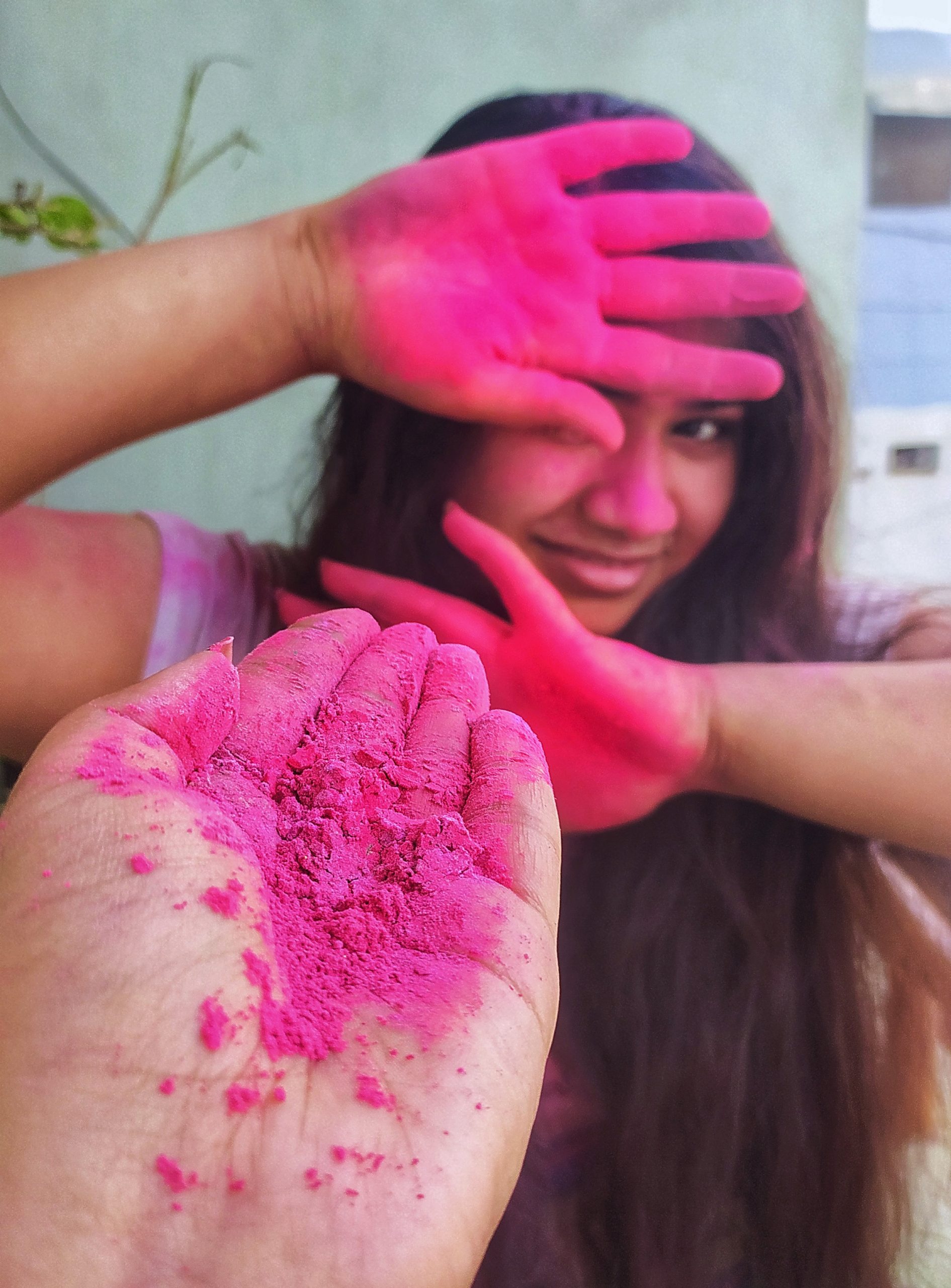 Girls' playing with Holi colors