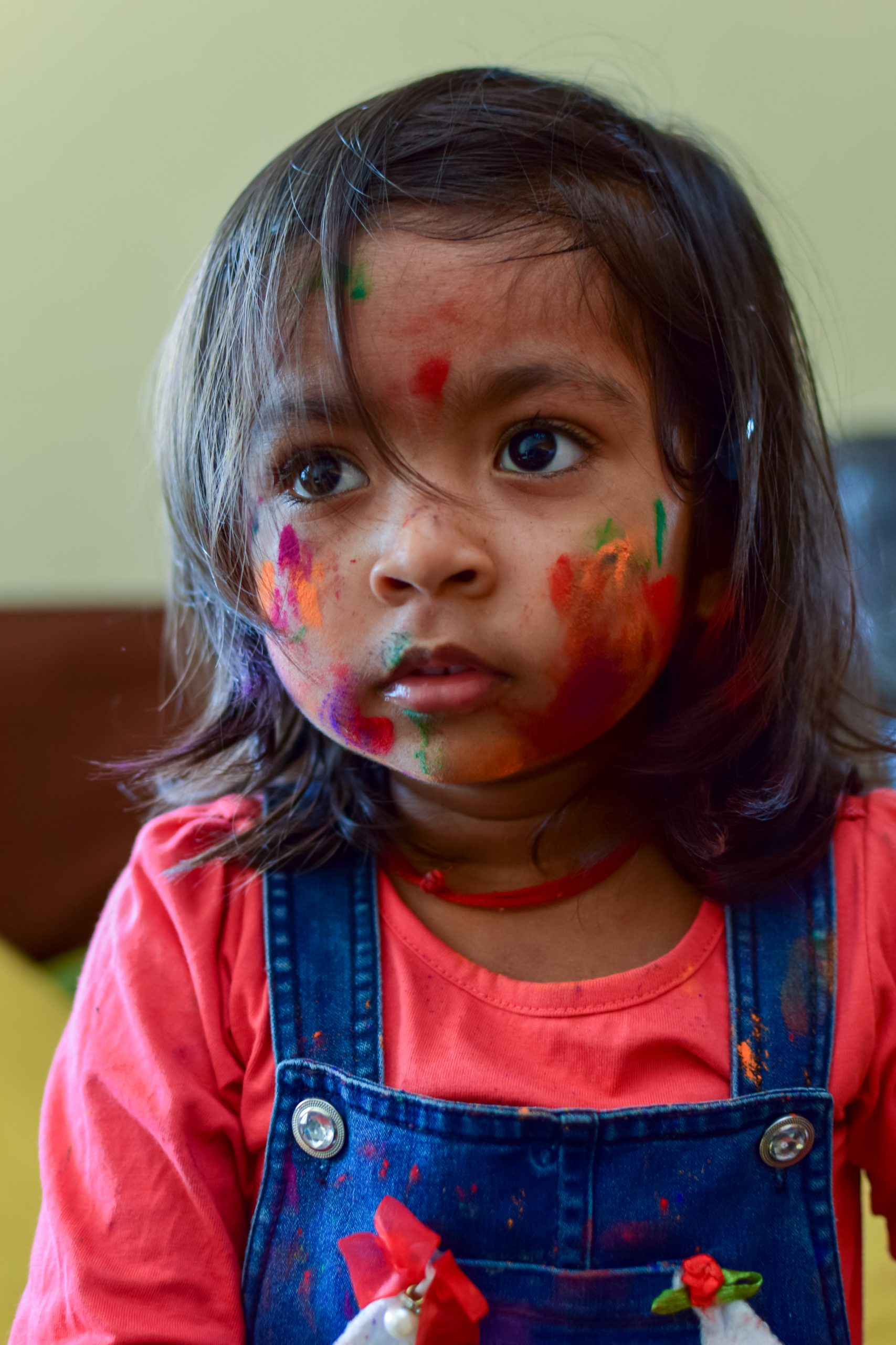 Holi colors on a child's face