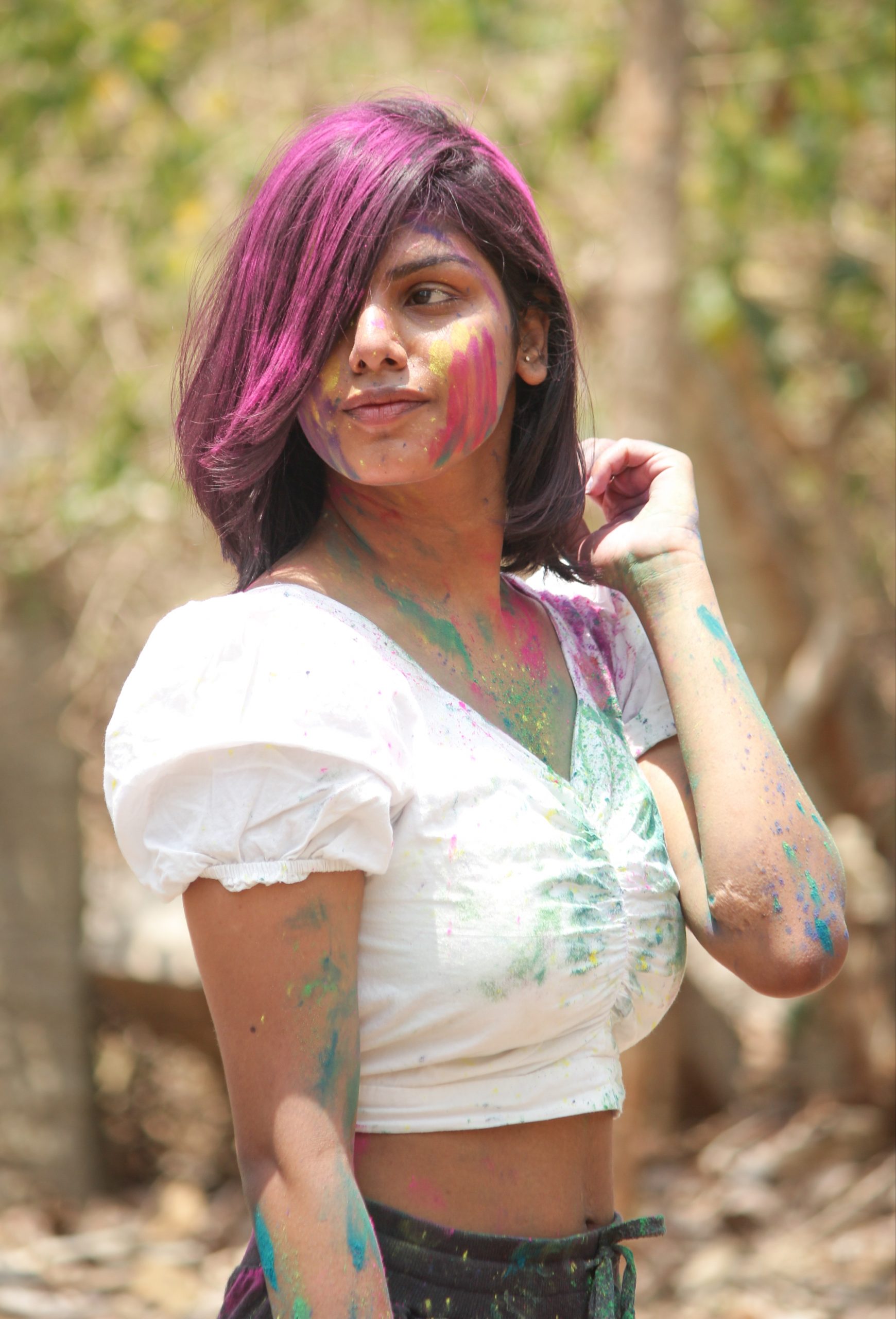 Holi colors on beautiful Girl's hair and face
