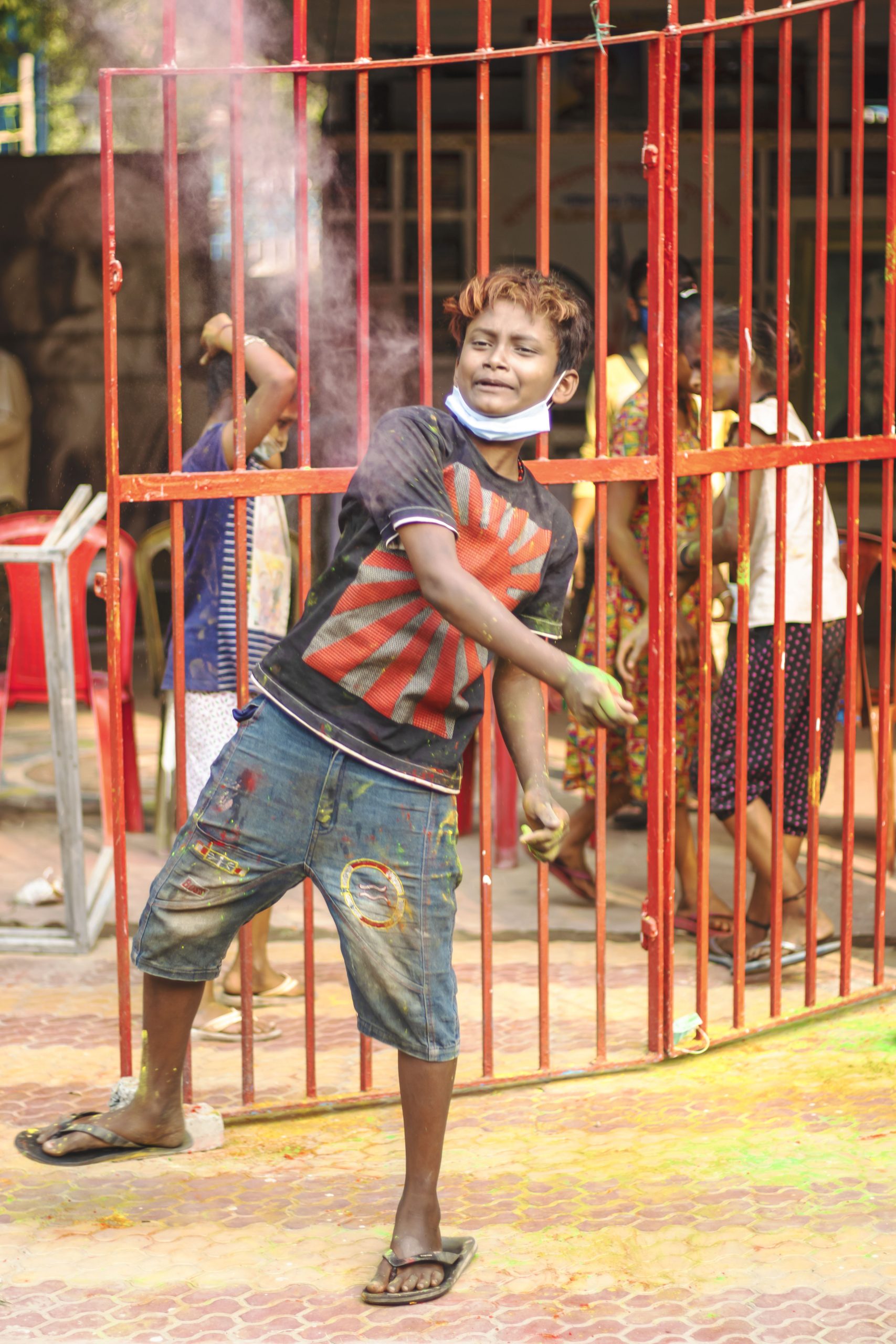 Kid celebrating Holi