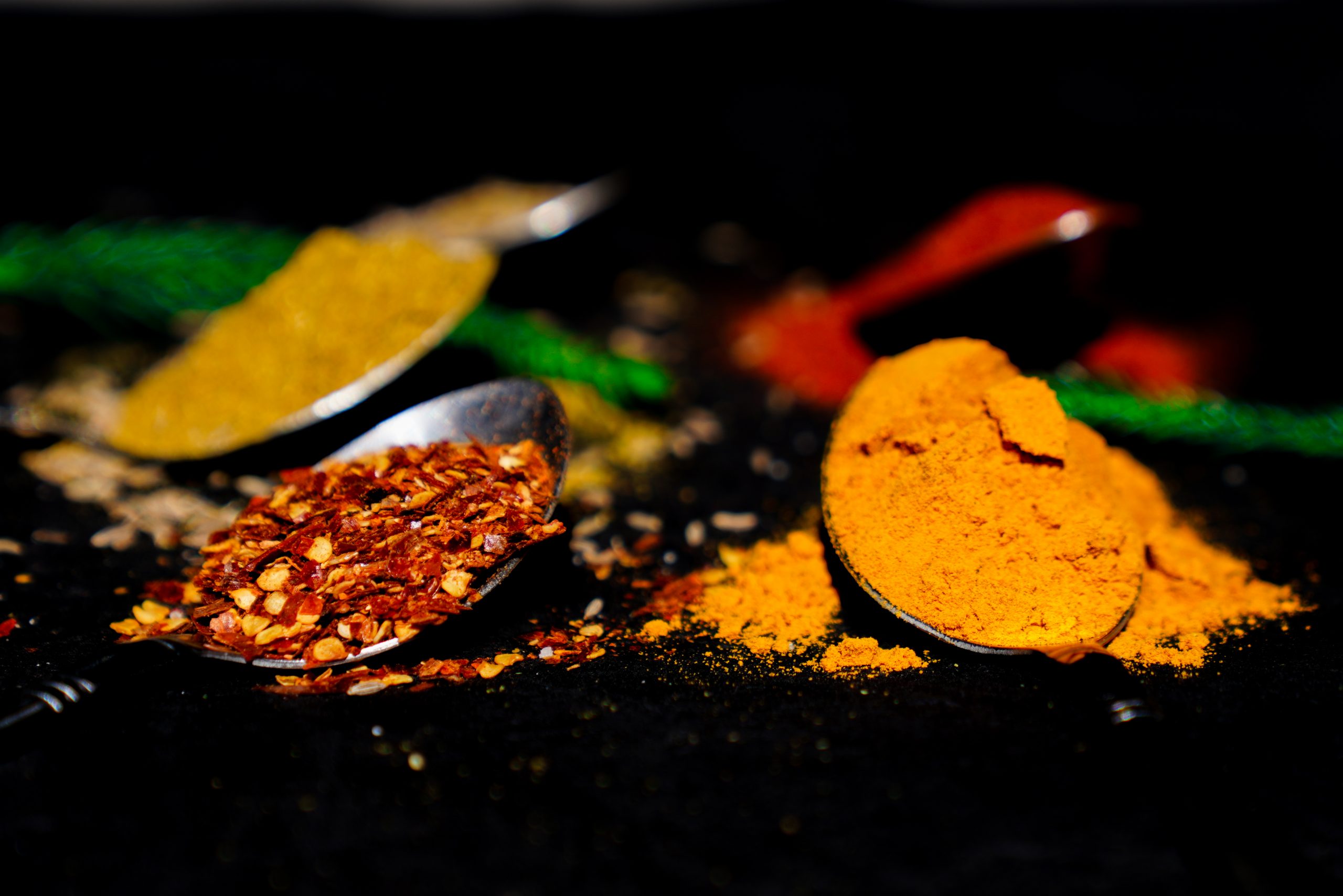Indian spices in spoons