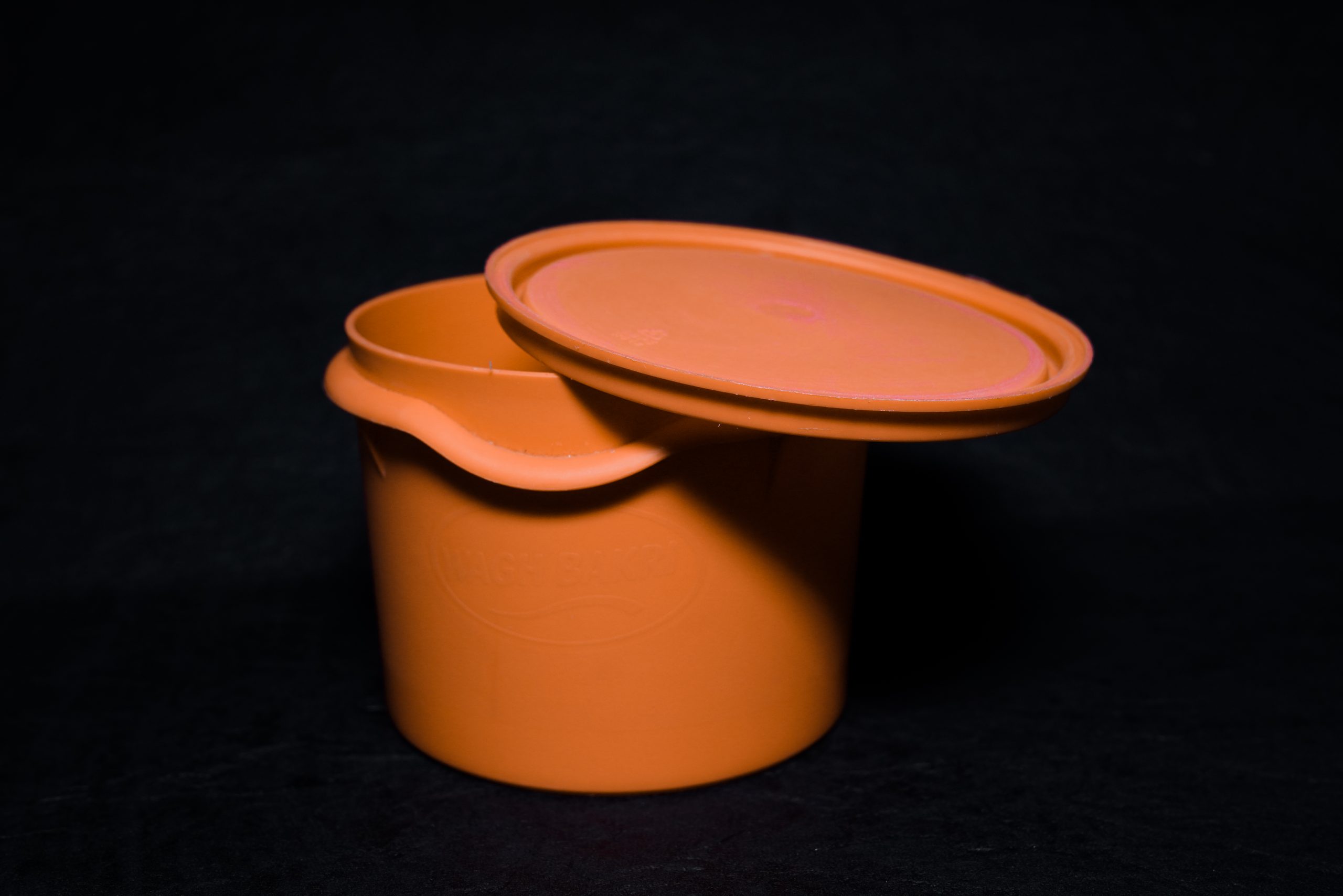 An orange tiffin box