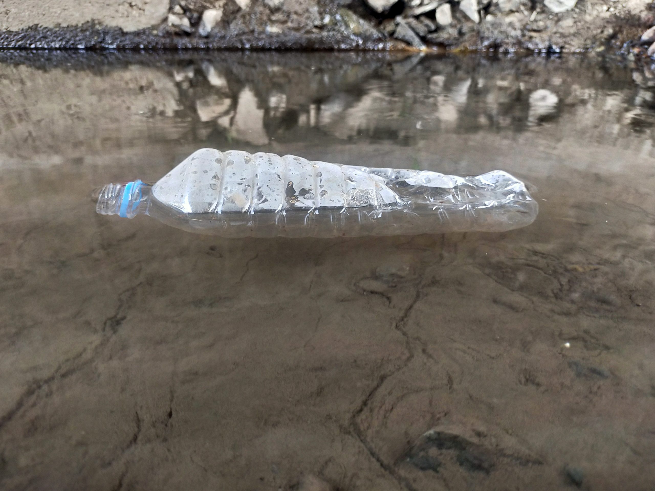 Plastic bottle in river
