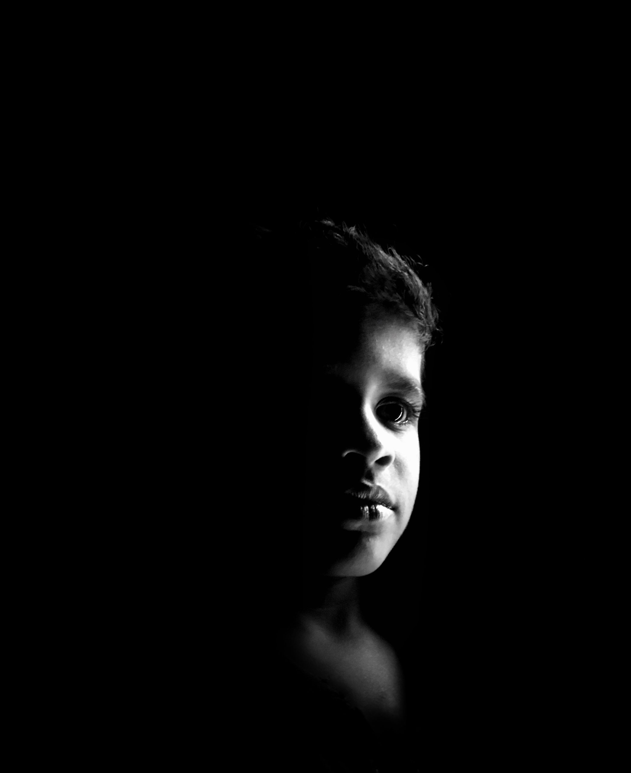 Black and white portrait of a kid
