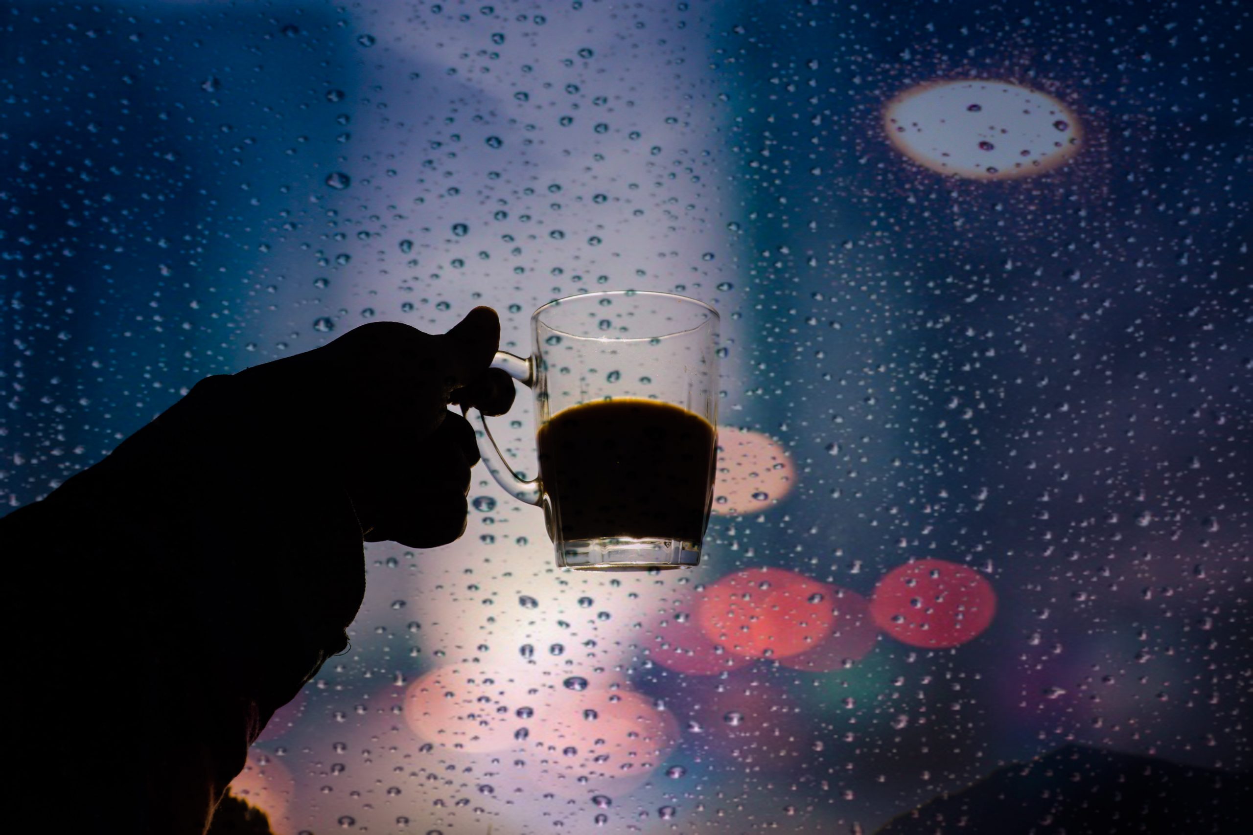 Rain drops falling on a teacup