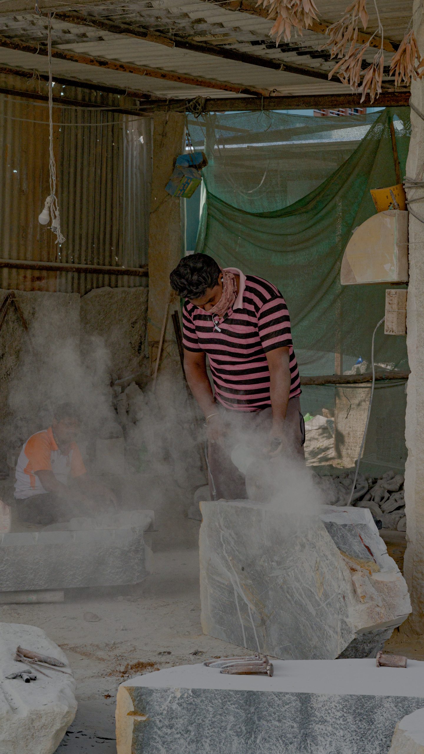 Man cutting marble stone