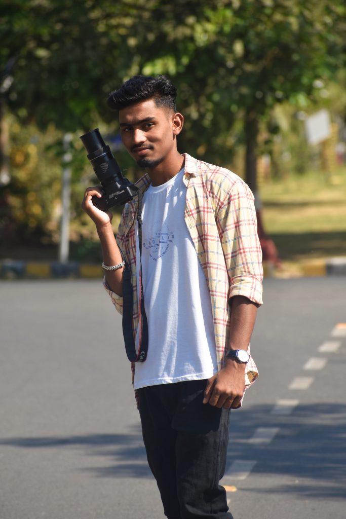 Boy posing with Camera - PixaHive