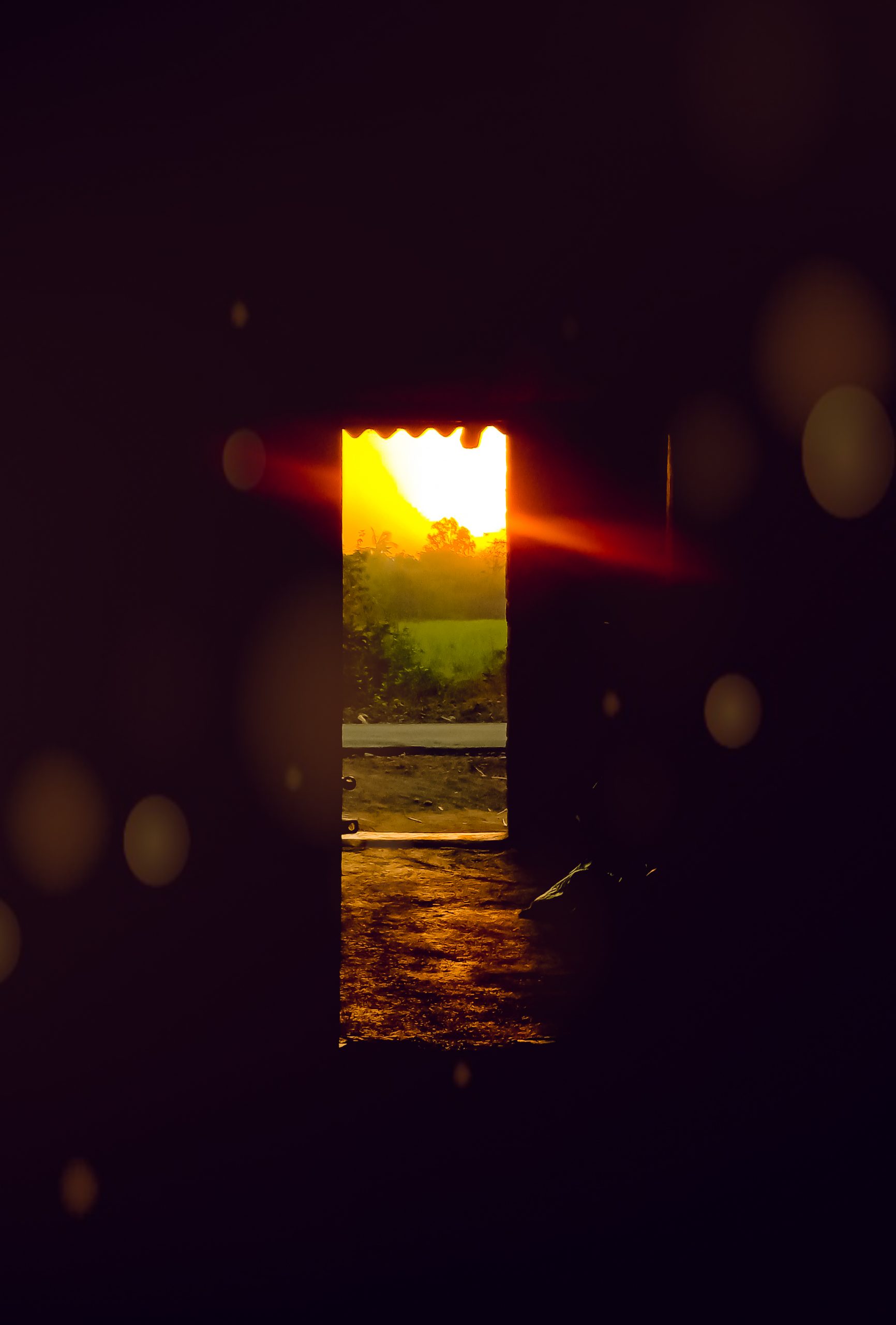 Sunrays falling in a room through a door