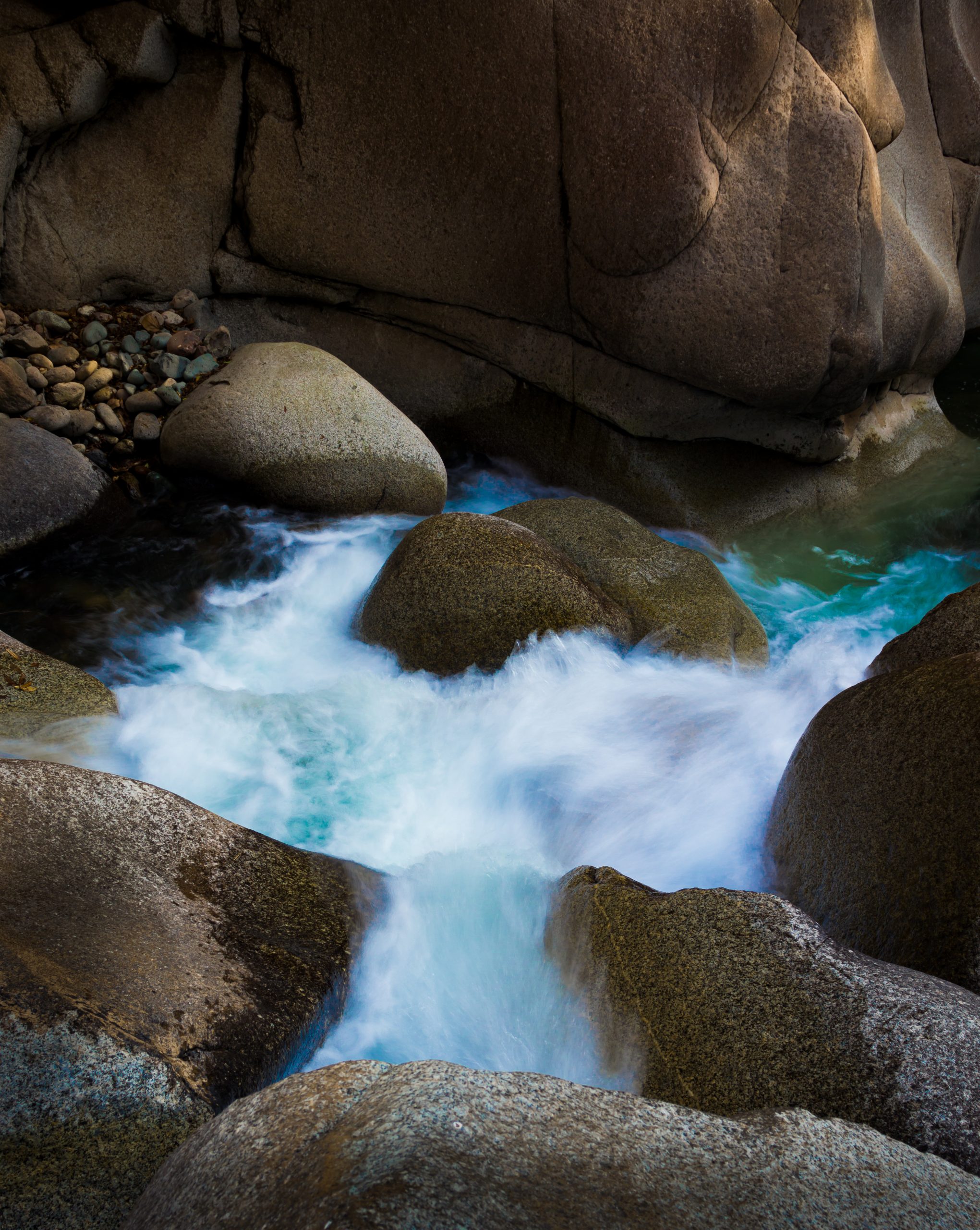 Water flowing through rocks and stones
