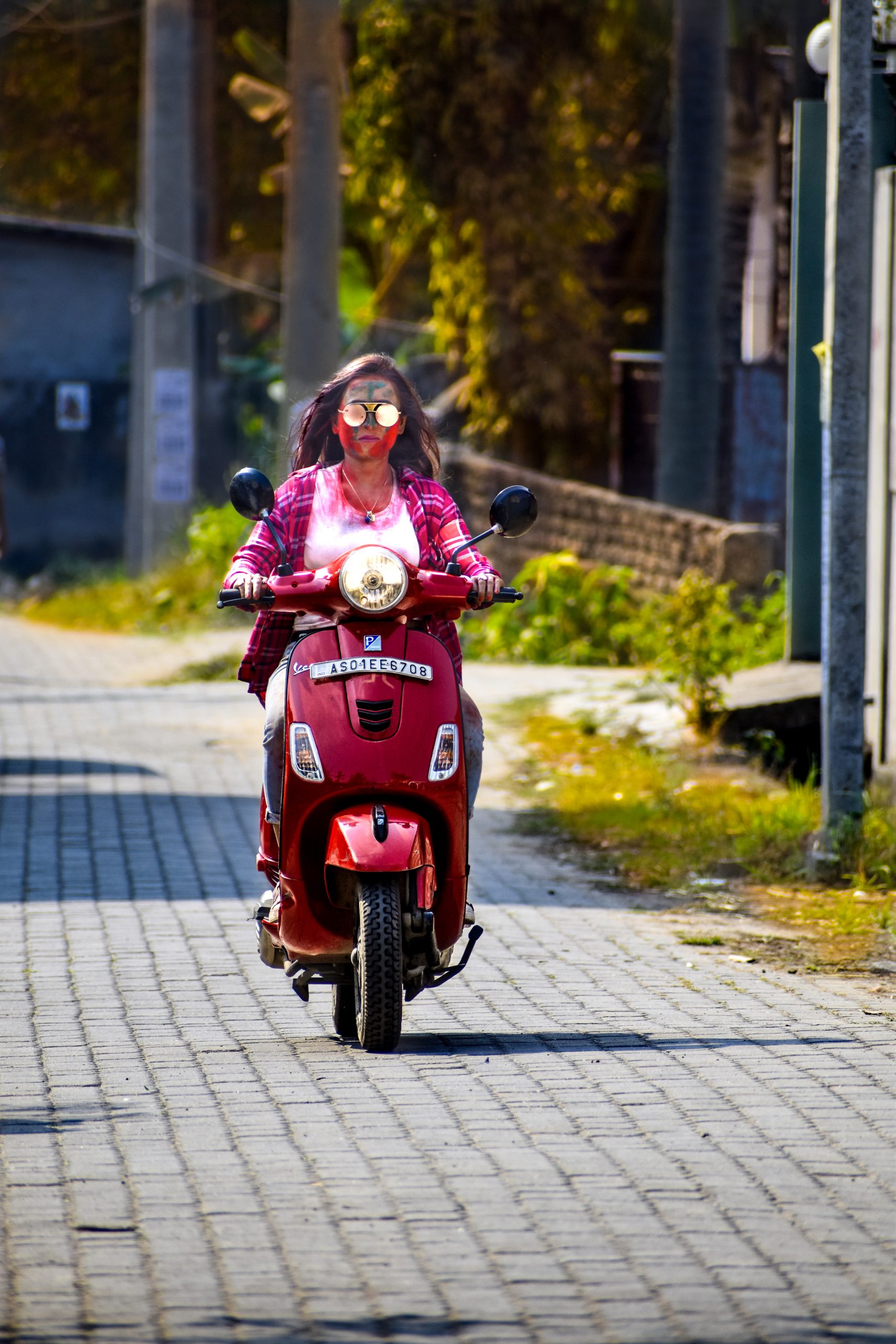 A girl driving a scooter