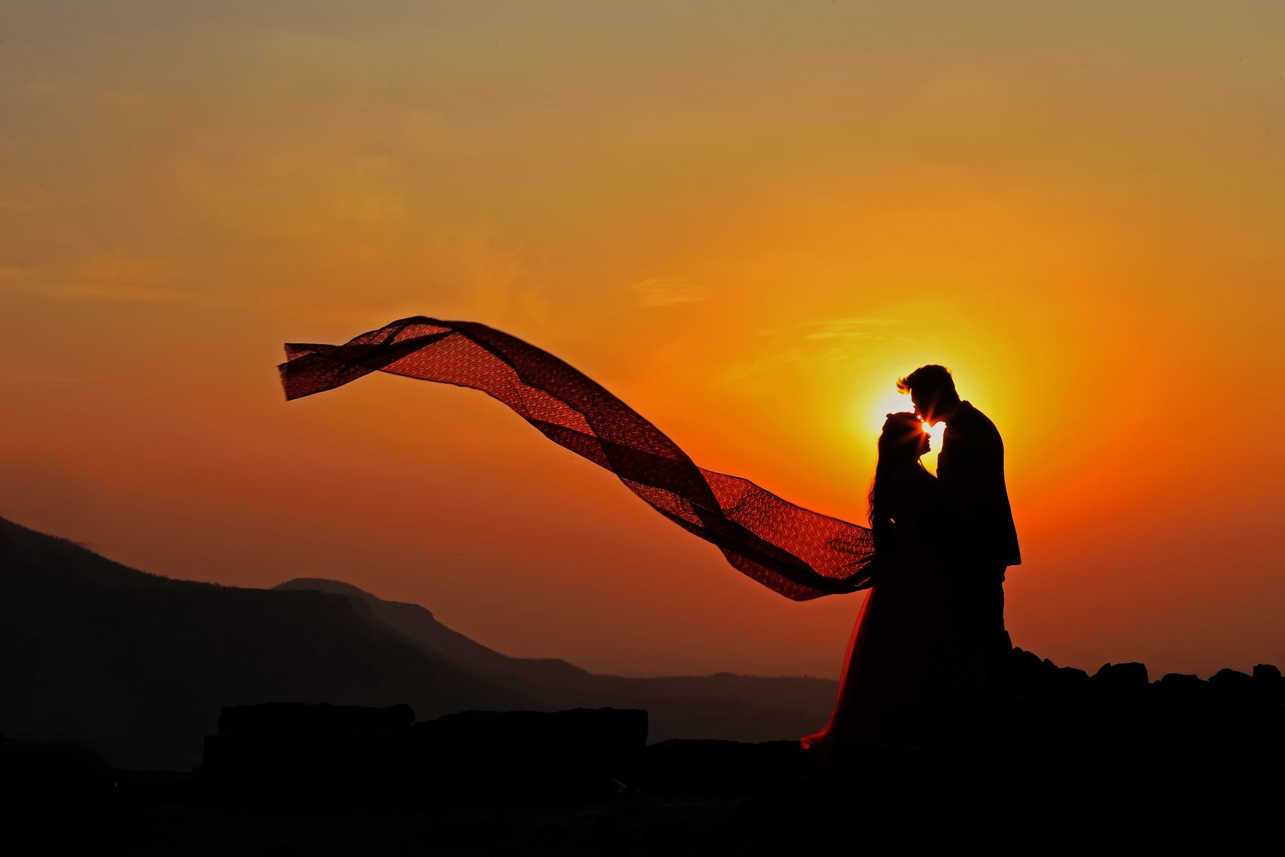 Silhouette of a loving couple in sunset