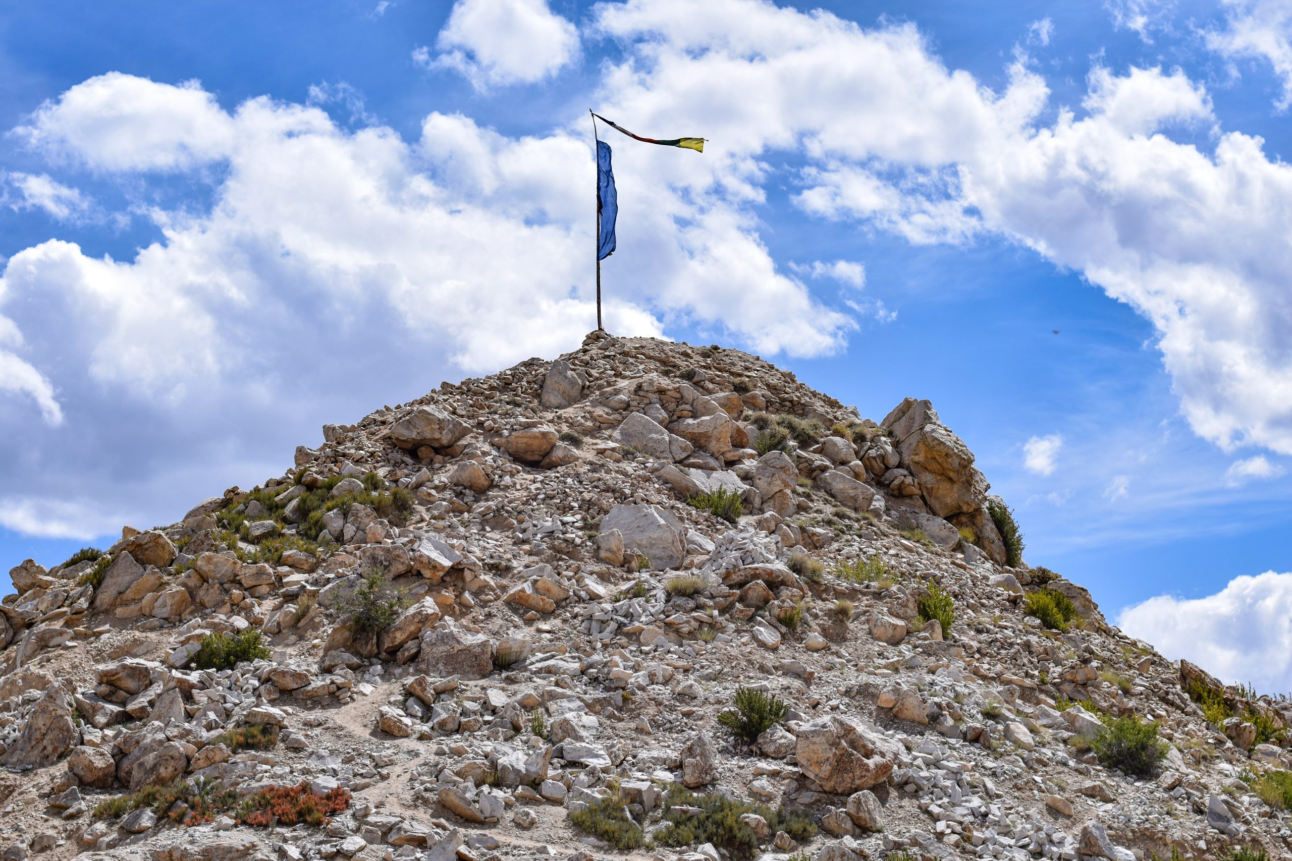 Flag waving on top of the mountain