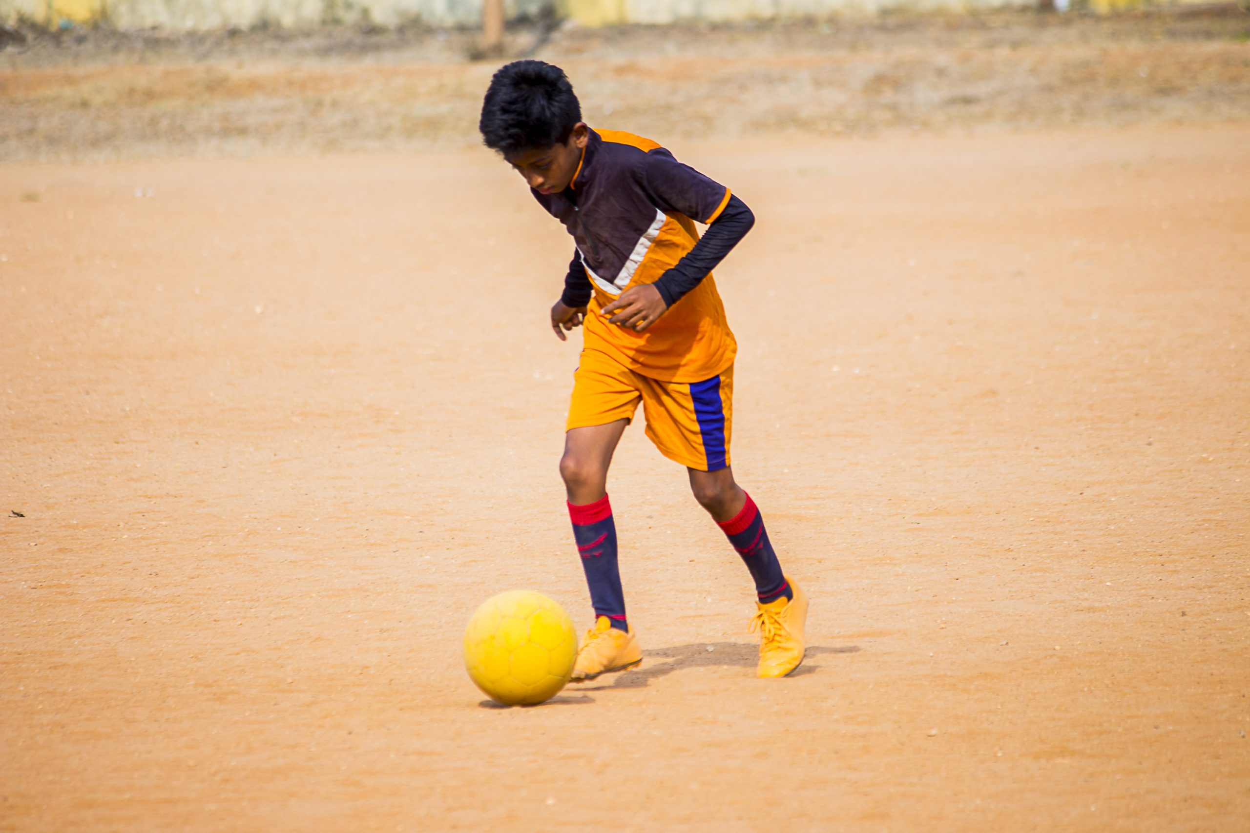 A Boy Playing Football