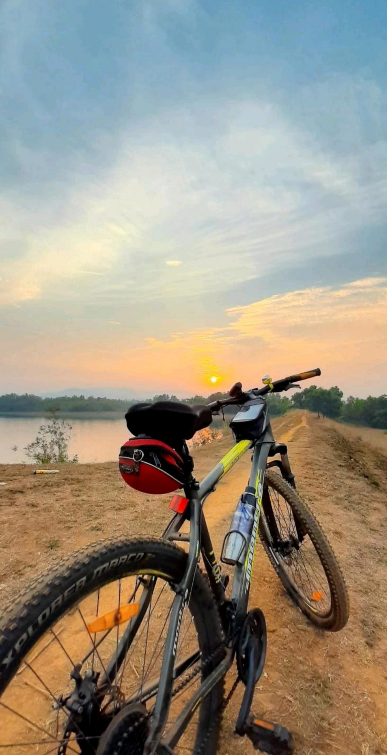 Bicycle in farm during sunset