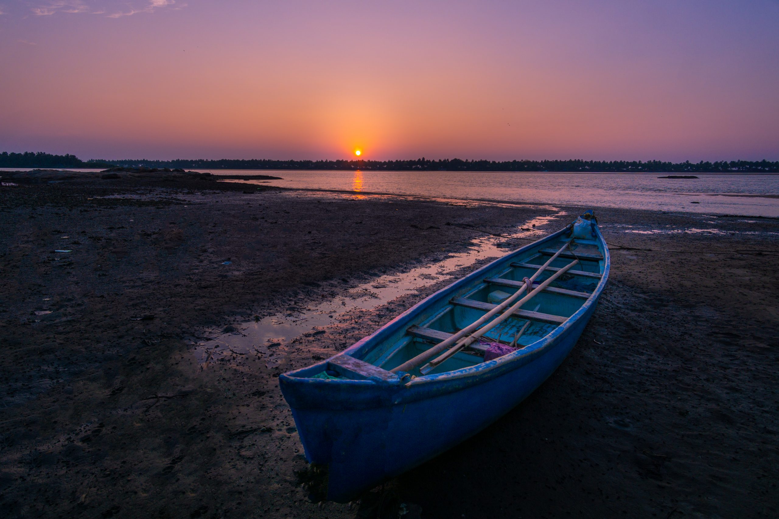 Boat near the river during beautiful sunset