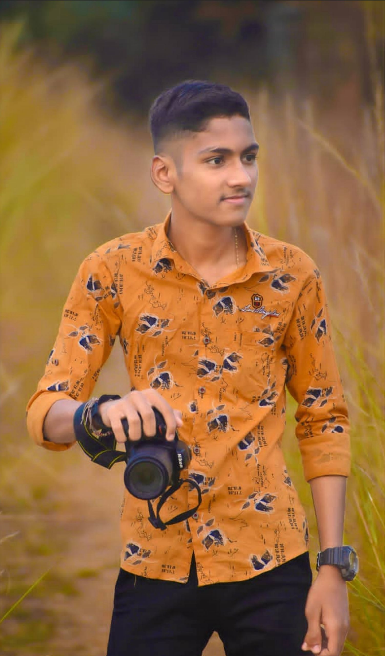 Boy posing with Camera