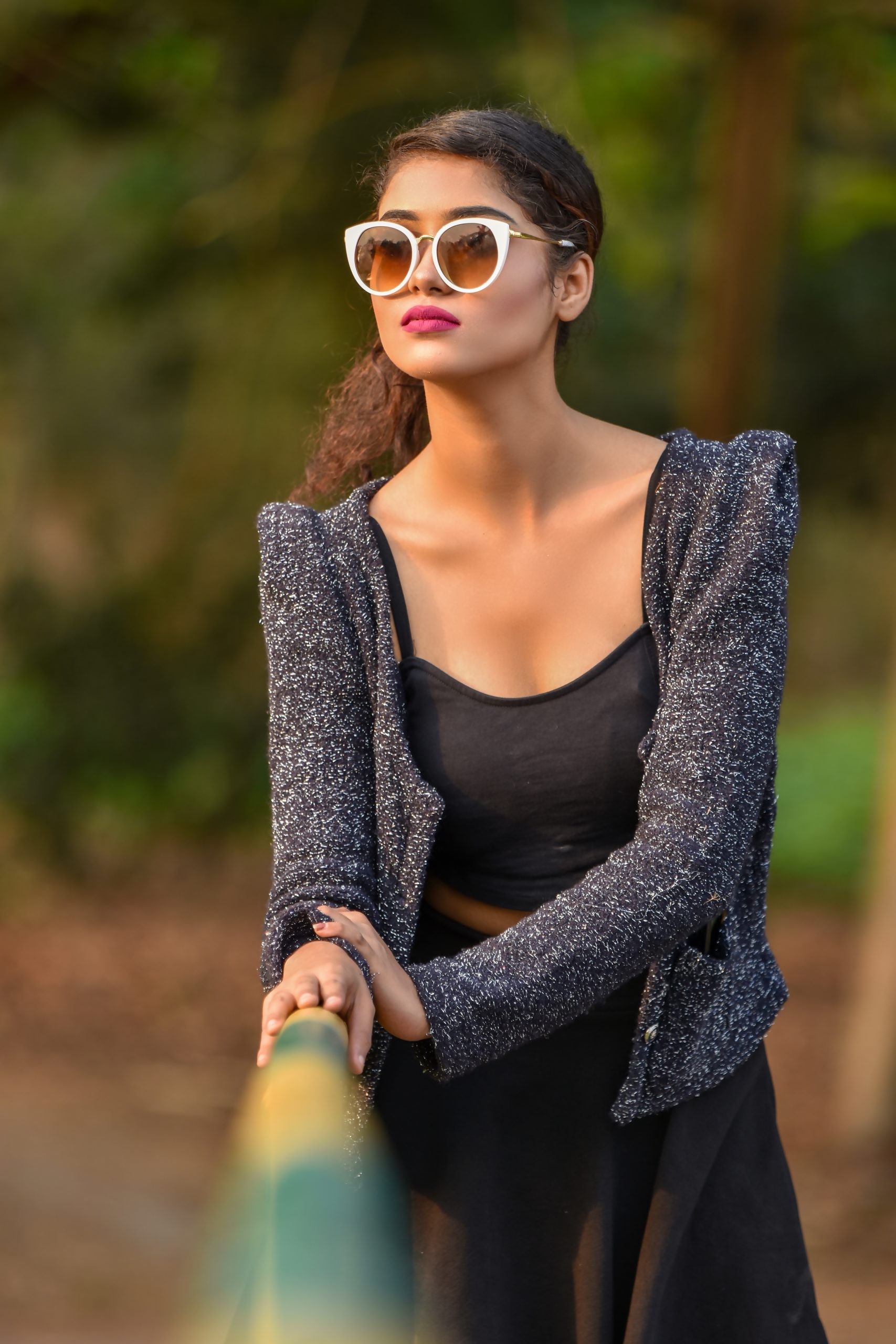 Female model posing with sunglasses
