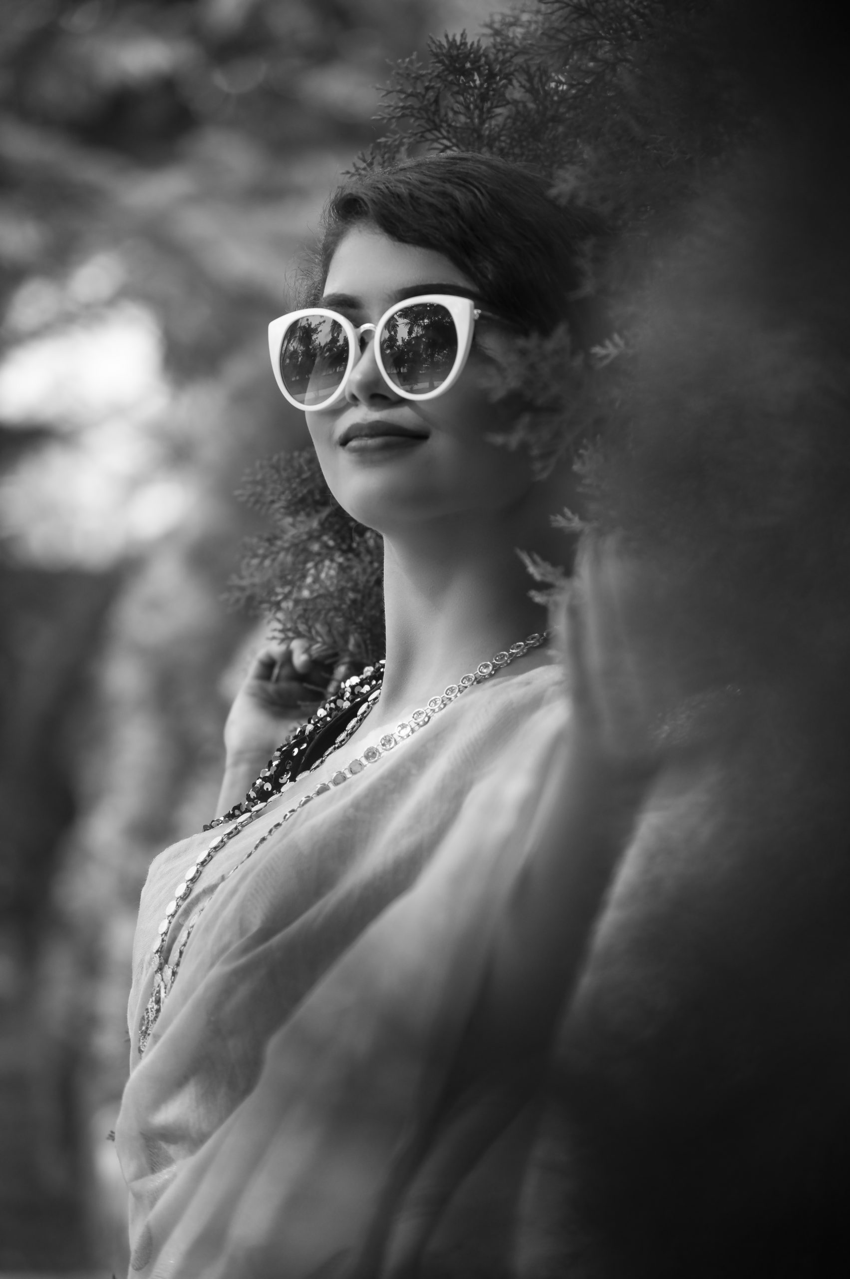 Female model posing with sunglasses