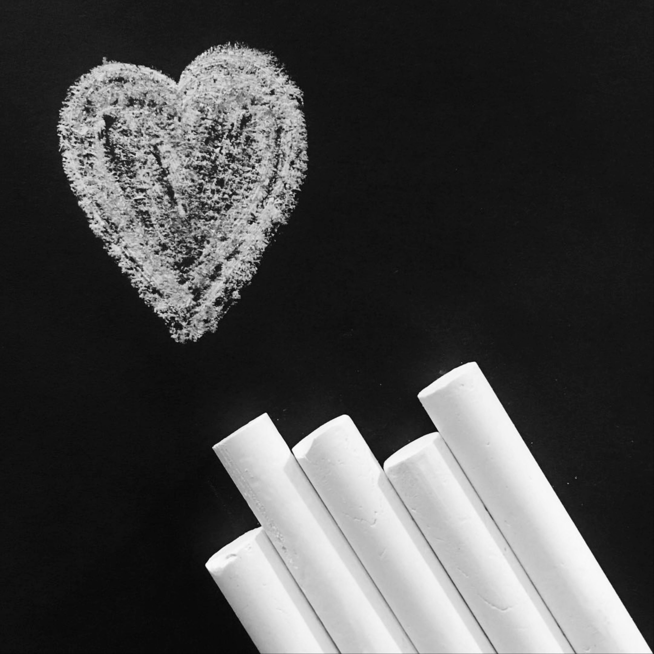 A heart shape and white chalks
