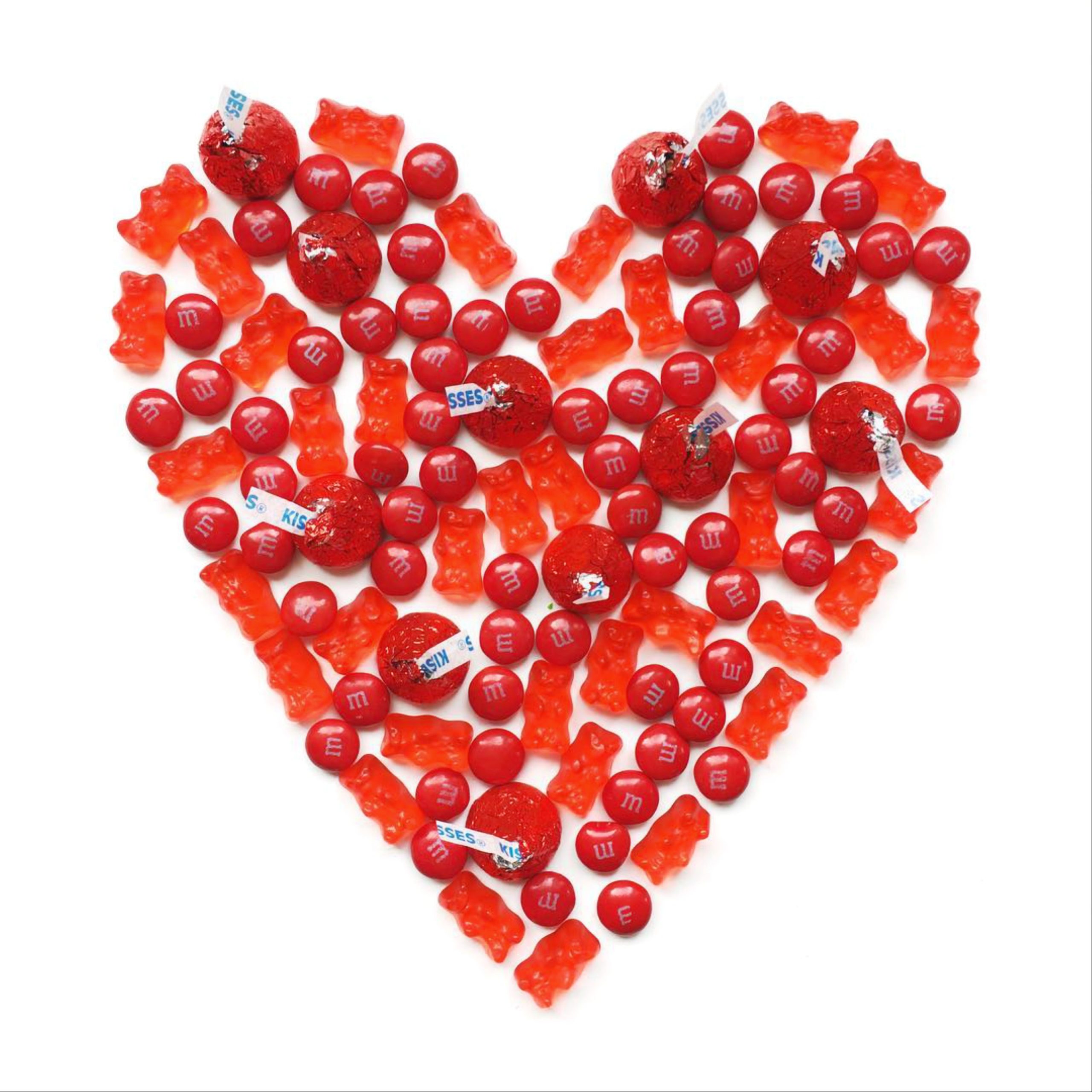A heart shape made with red candies