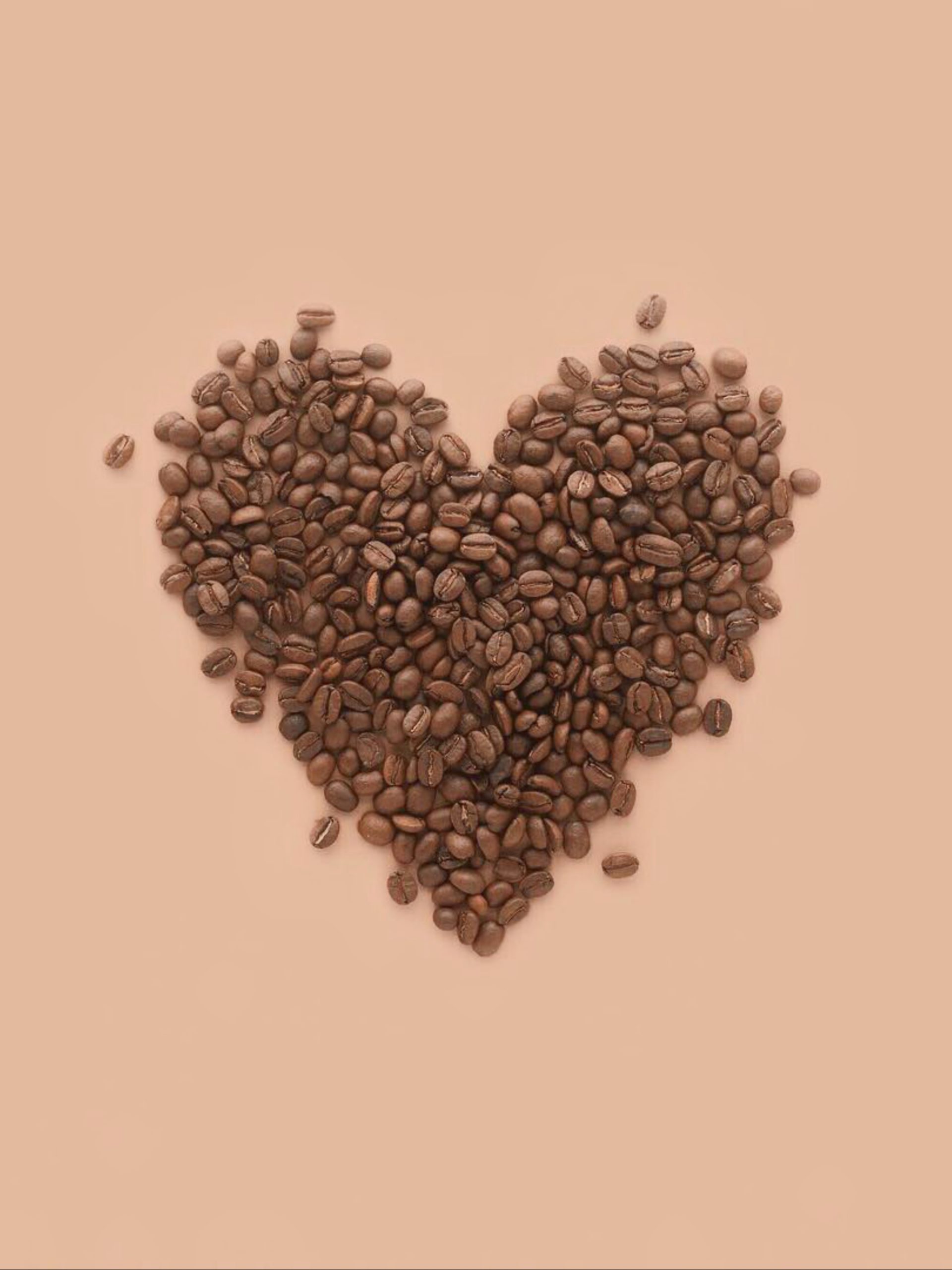 Heart shape made with coffee beans