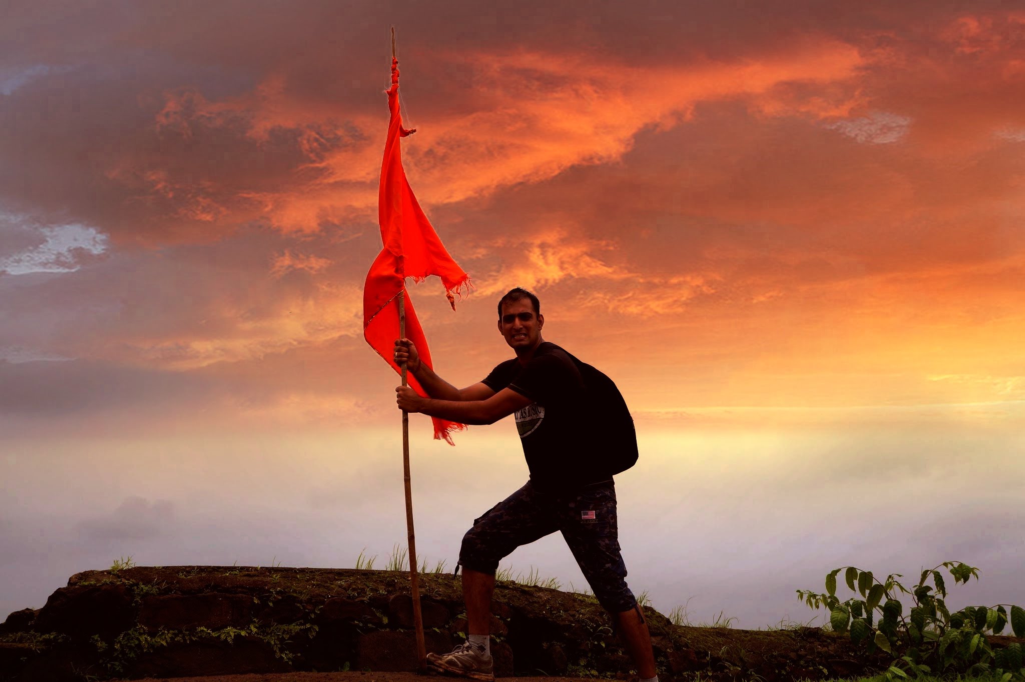 Man posing with flag