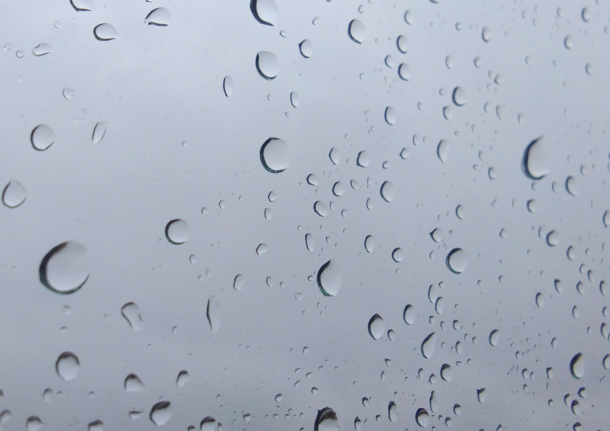 Landscape of rain drops on glass