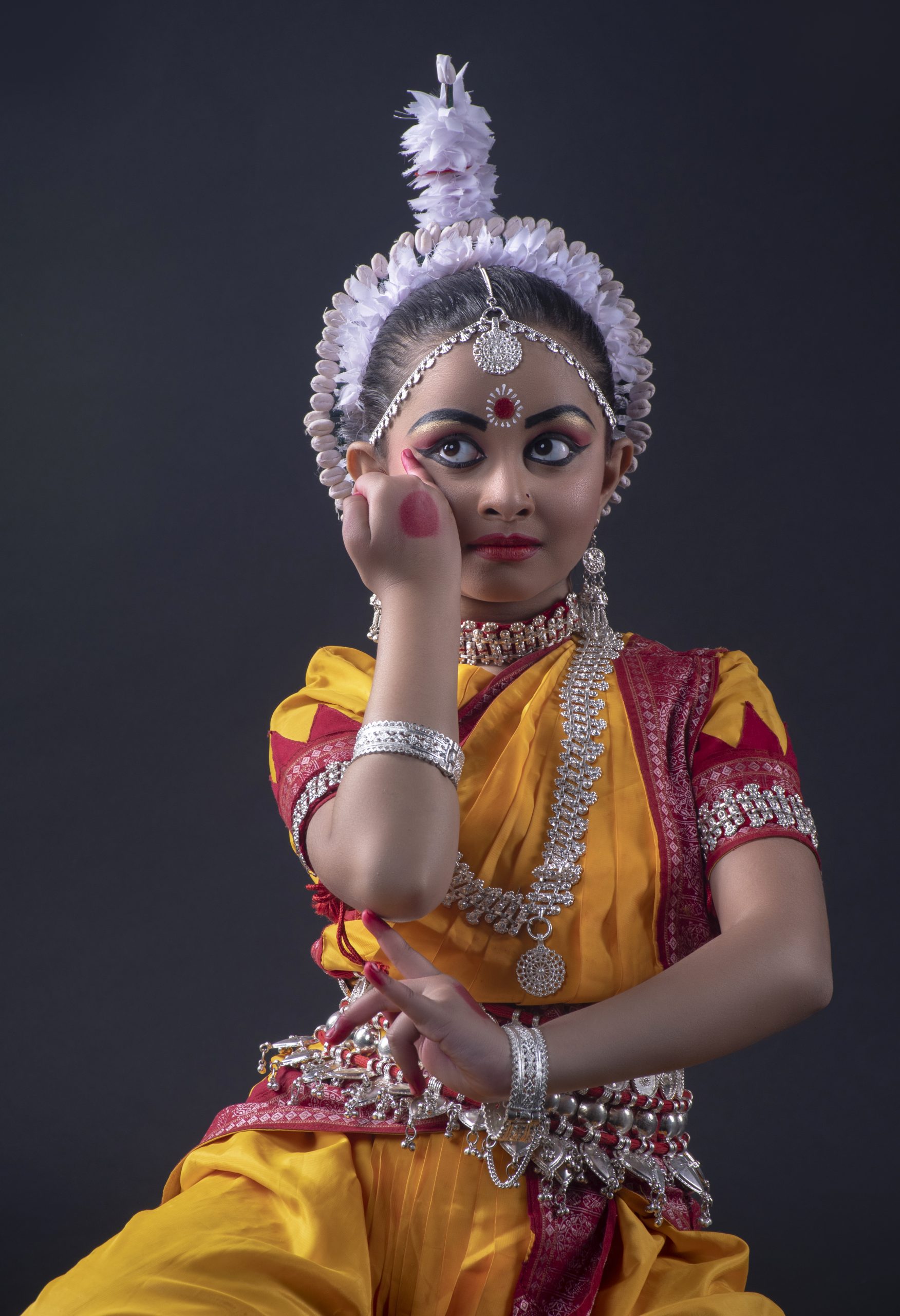 A little girl performing classical dance